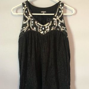 Black tank top with jewels.